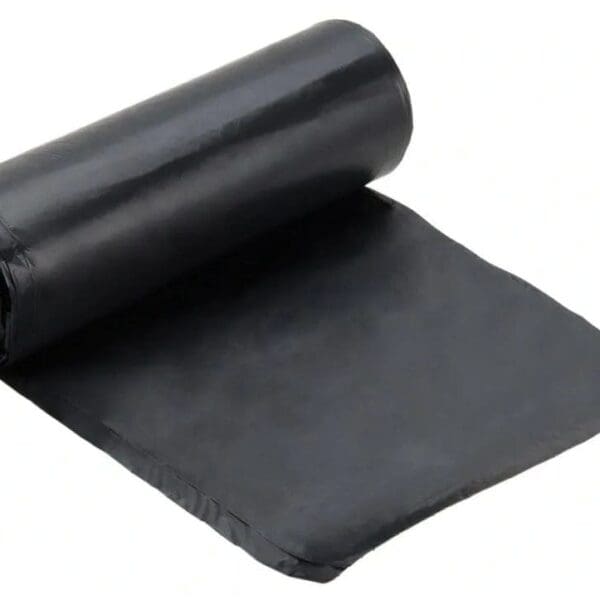 A roll of black plastic is sitting on top of the floor.
